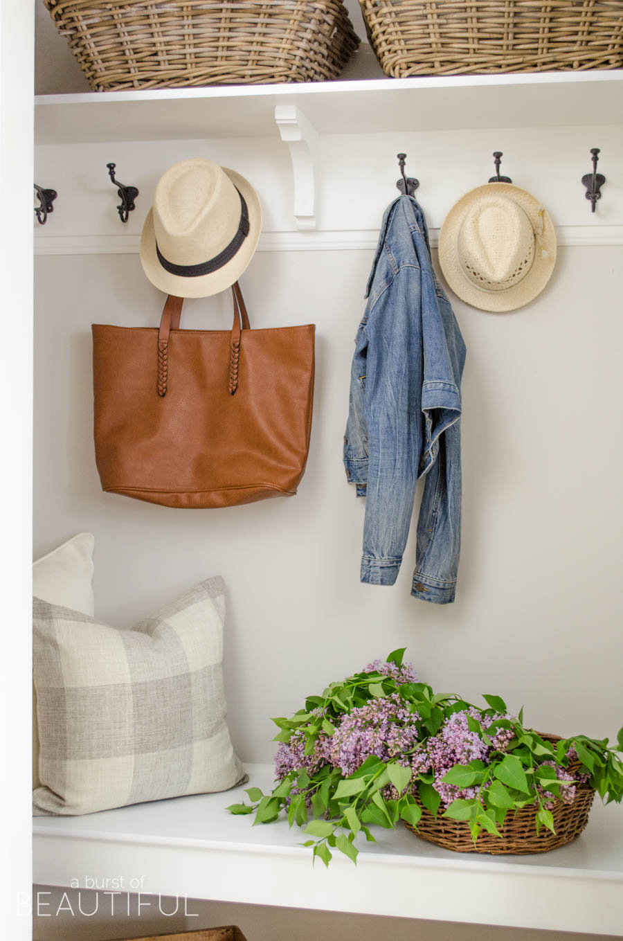 A simple mudroom exudes character and charm in this young family's modern farmhouse. 