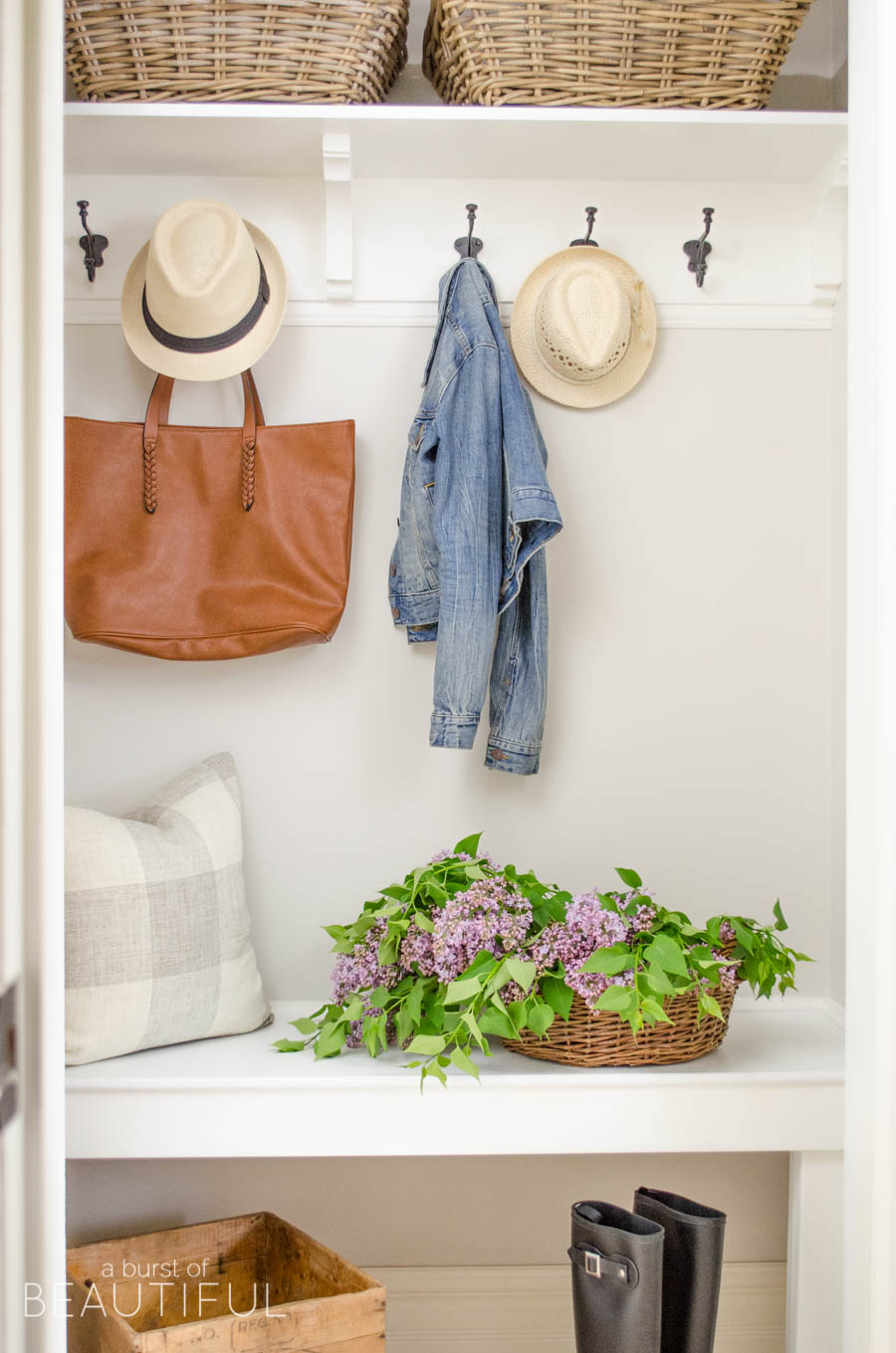 A simple mudroom exudes character and charm in this young family's modern farmhouse. 