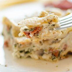 Serve this creamy portobello mushroom and sundried tomato lasagna with a homemade caesar salad and garlic loaf for a hearty and comforting meal.