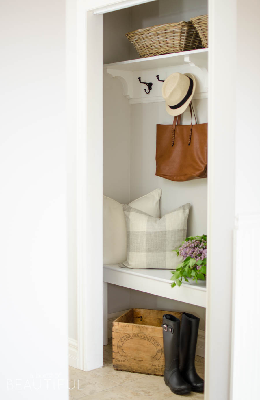 A cramped coat closet turns into a beautiful farmhouse inspired entry for a busy family with this simple makeover | A Burst of Beautiful 
