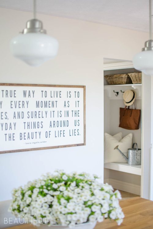 A custom wood sign adds charm and character to this beautiful farmhouse kitchen | A Burst of Beautiful