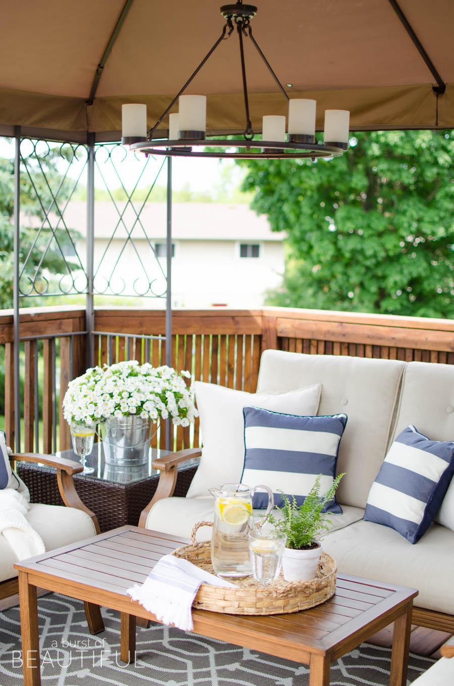 Learn how to revive a wood deck and create a beautiful outdoor living space with these easy to follow instructions from A Burst of Beautiful 