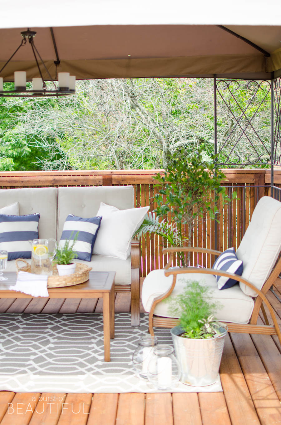Learn how to revive a wood deck and create a beautiful outdoor living space with these easy to follow instructions from A Burst of Beautiful 