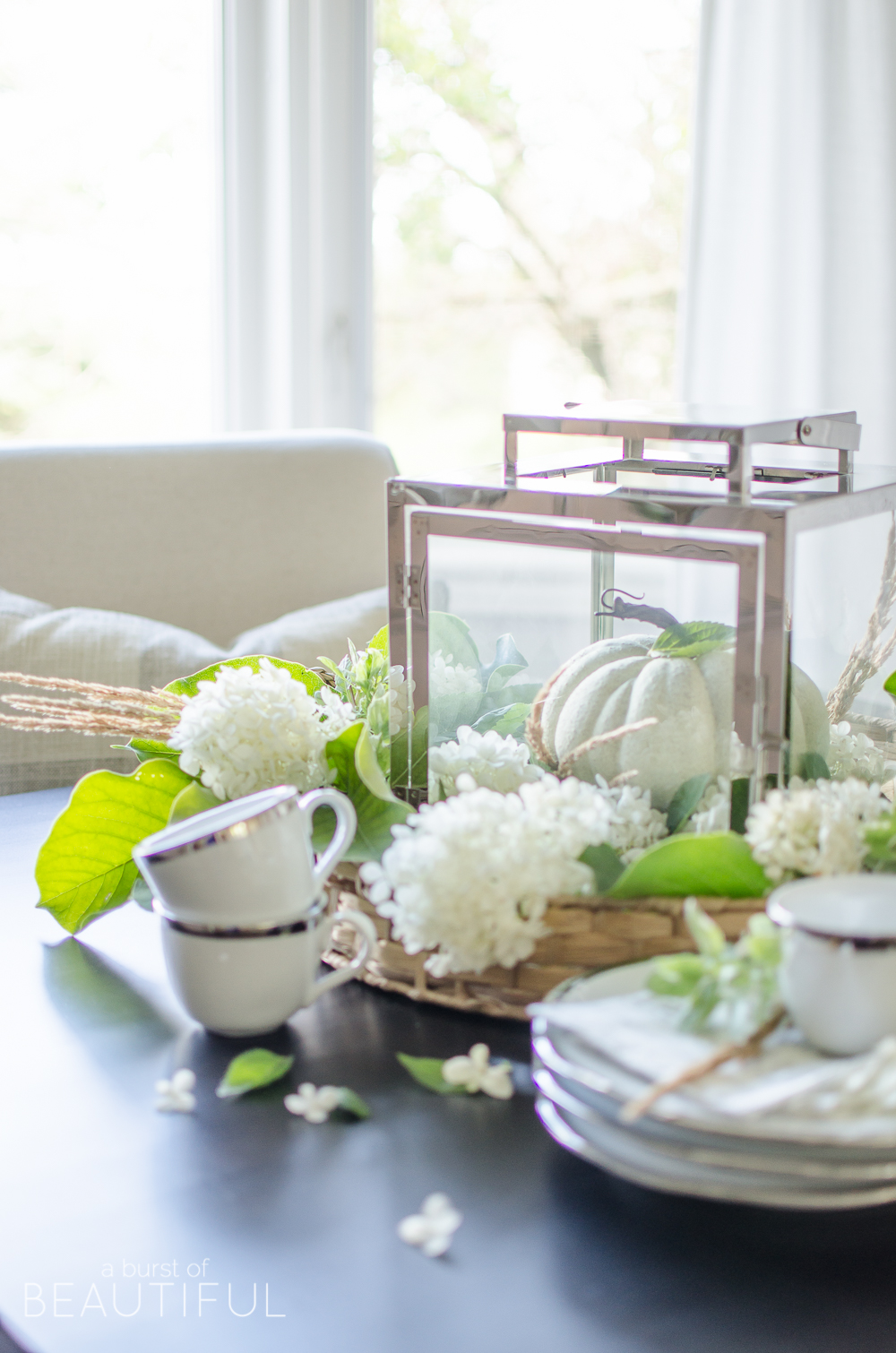 Hydrangeas, magnolia leaves and grasses create a simple and easy fall centerpiece. 
