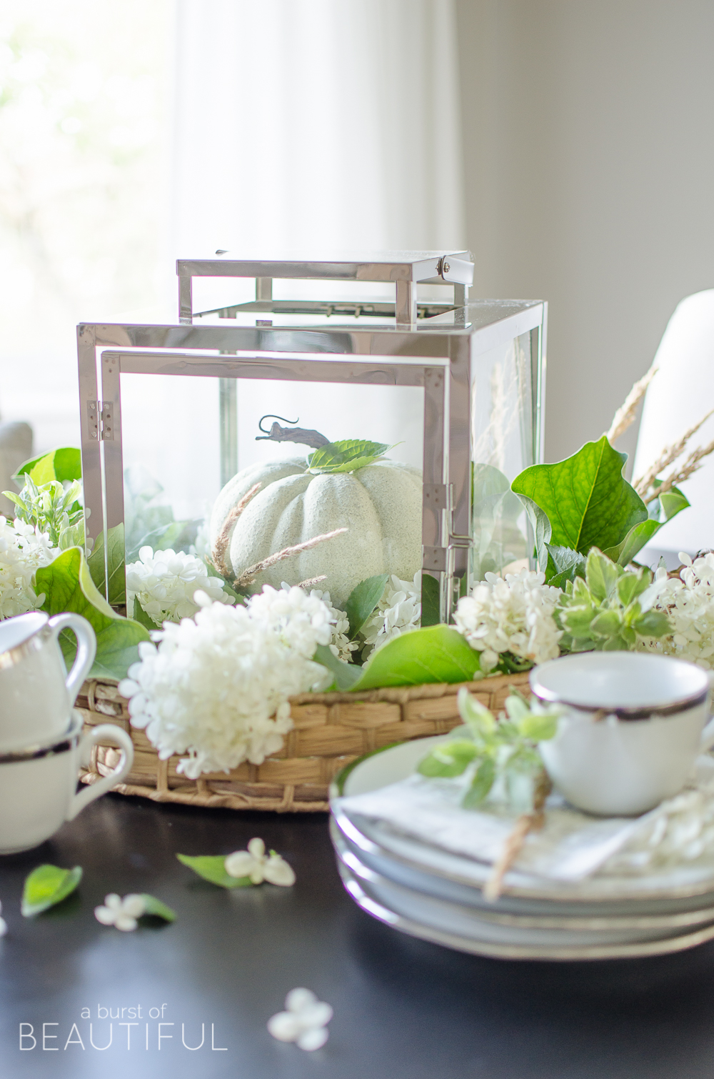 Hydrangeas, magnolia leaves and grasses create a simple and easy fall centerpiece. 