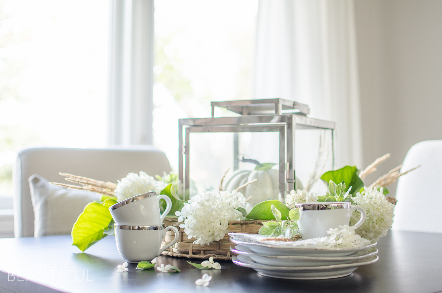 Hydrangeas, magnolia leaves and grasses create a simple and easy fall centerpiece. 