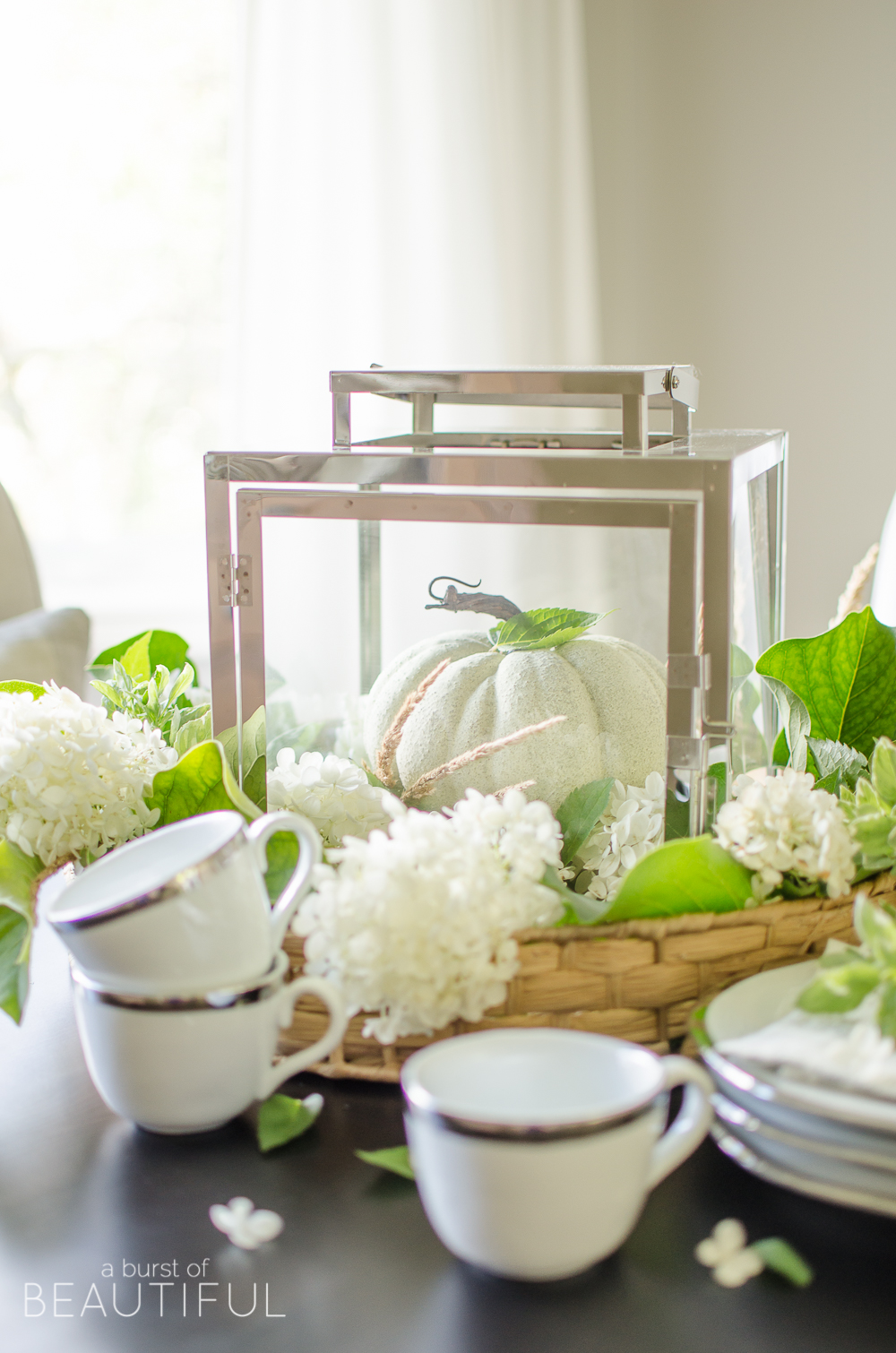 Hydrangeas, magnolia leaves and grasses create a simple and easy fall centerpiece. 