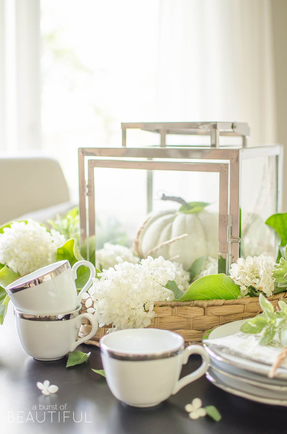 Hydrangeas, magnolia leaves and grasses create a simple and easy fall centerpiece. 