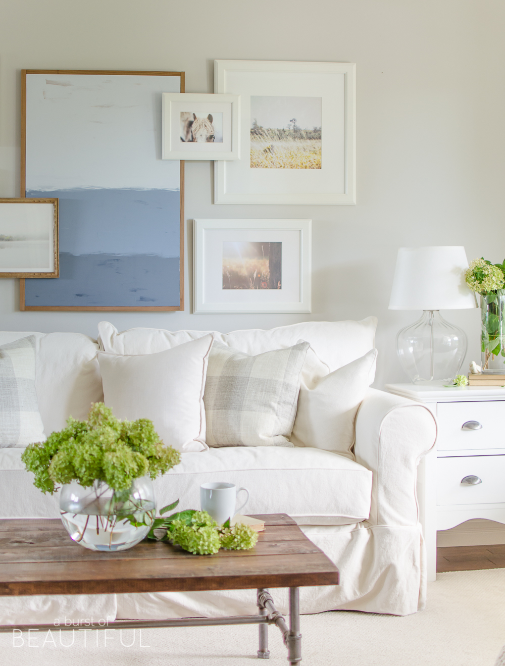 A white slipcovered sofa creates a casual and relaxed feel in this modern farmhouse
