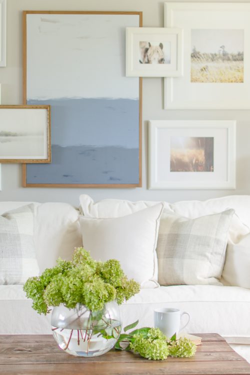 A white slipcovered sofa creates a casual and relaxed feel in this modern farmhouse