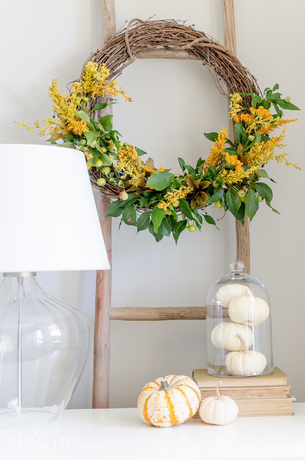 A simple DIY natural fall wreath adds a pop of color to seasonal decor. 