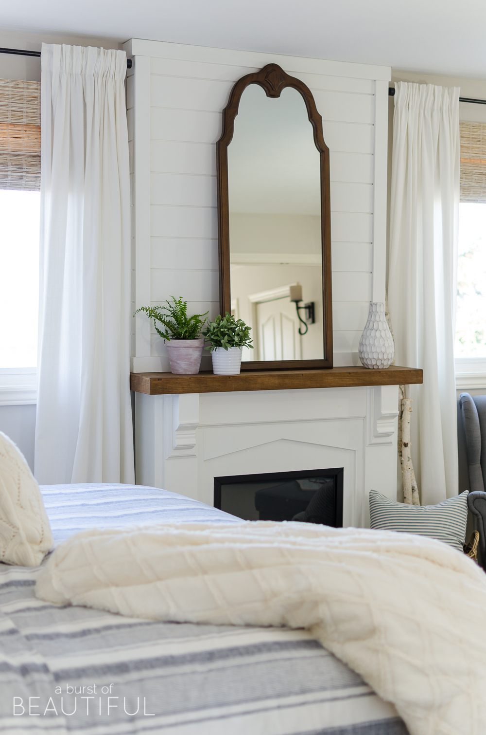 Woven wood shades add texture, color and warmth to this modern farmhouse