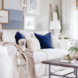 Natural wood tones, copper accessories and faux fur and velvet textiles create a cozy Christmas living room