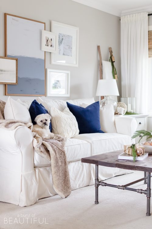 Natural wood tones, copper accessories and faux fur and velvet textiles create a cozy Christmas living room