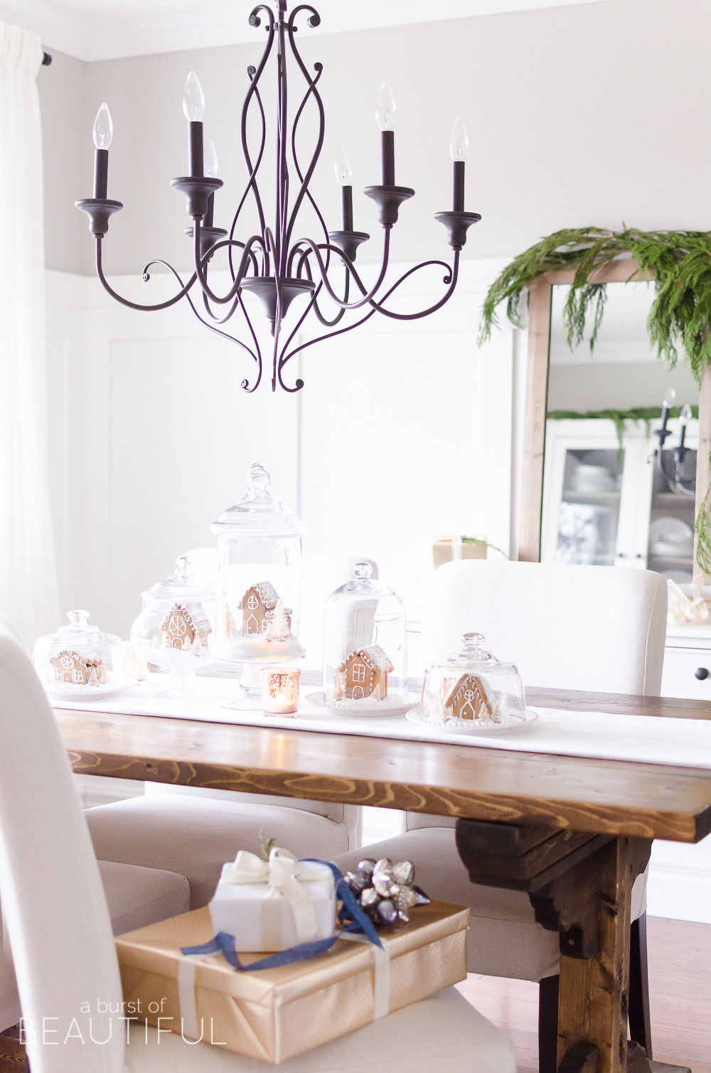 An inviting holiday dining room in this modern farmhouse is full of whimsical Christmas charm