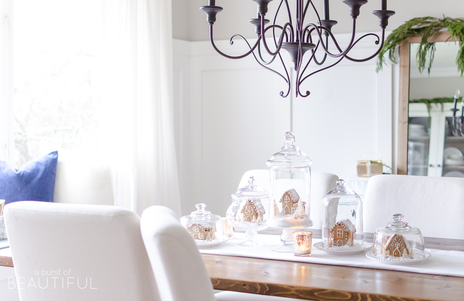 An inviting holiday dining room in this modern farmhouse is full of whimsical Christmas charm