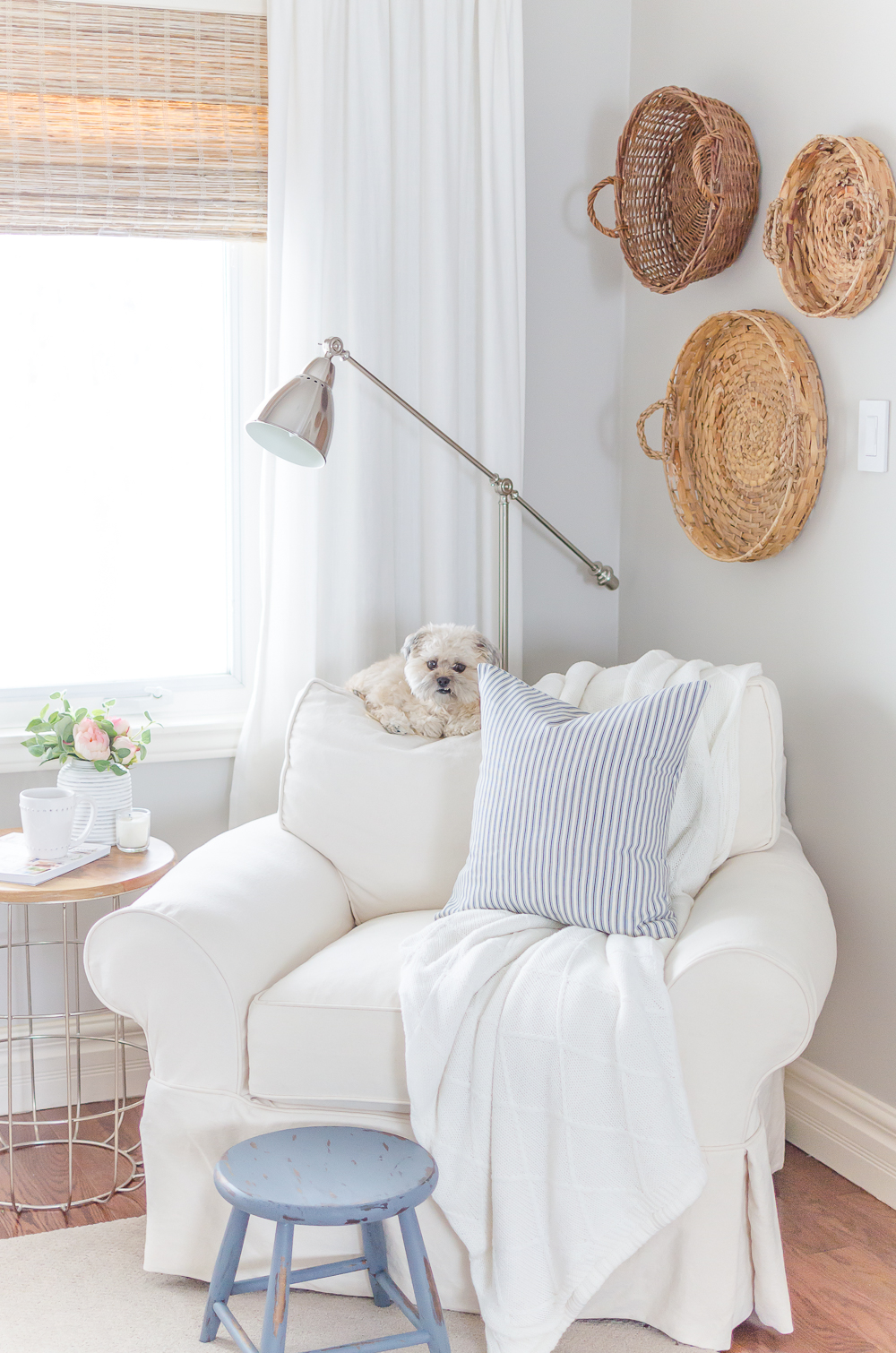 A distressed foot stool adds character to this cozy modern farmhouse. Find the project in A Touch of Farmhouse Charm by Liz Fourez. 