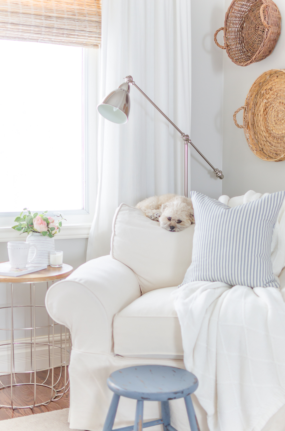 A distressed foot stool adds character to this cozy modern farmhouse. Find the project in A Touch of Farmhouse Charm by Liz Fourez.