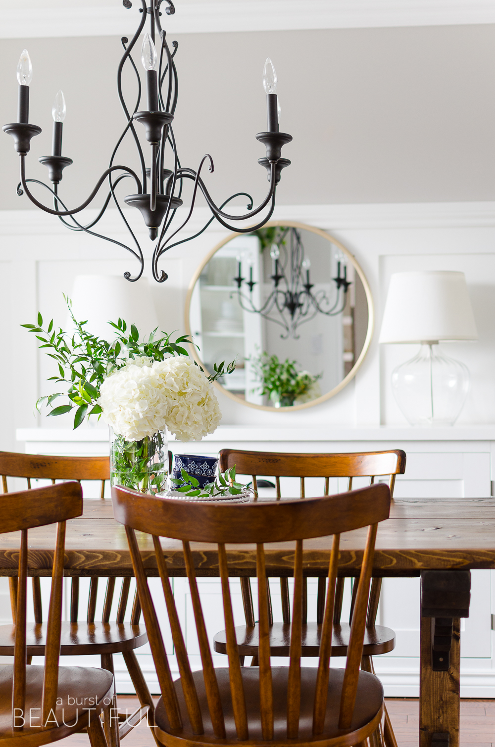 Spring Home Tour | Our Dining Room - A modern farmhouse feels bright and inviting as it embraces the spring season. Tour the full home at www.aburstofbeautiful.com. 