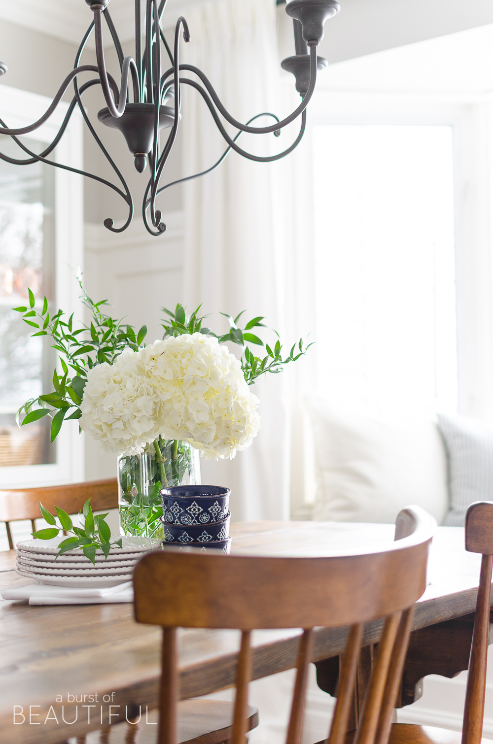 Spring Home Tour | Our Dining Room - A modern farmhouse feels bright and inviting as it embraces the spring season. Tour the full home at www.aburstofbeautiful.com. 