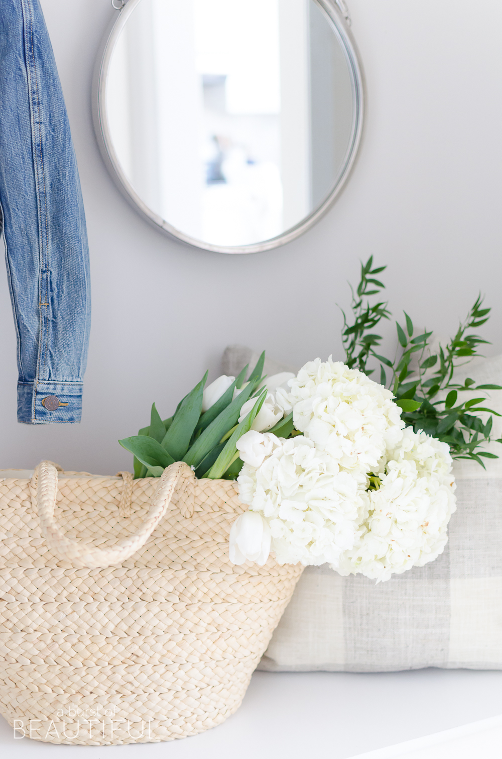 A pretty and functional mudroom is ready for the season in this modern farmhouse's bright and inviting spring home tour.