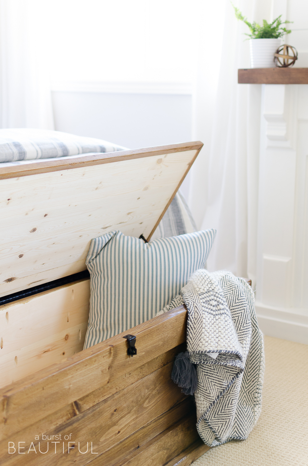 This DIY blanket storage chest will fit beautifully into any space and provides great additional storage for items such as blankets, pillows and toys. It can also be used as a coffee table, bench in an entryway or at the foot of a bed. It's simple, clean lines make it a timeless piece for your home.