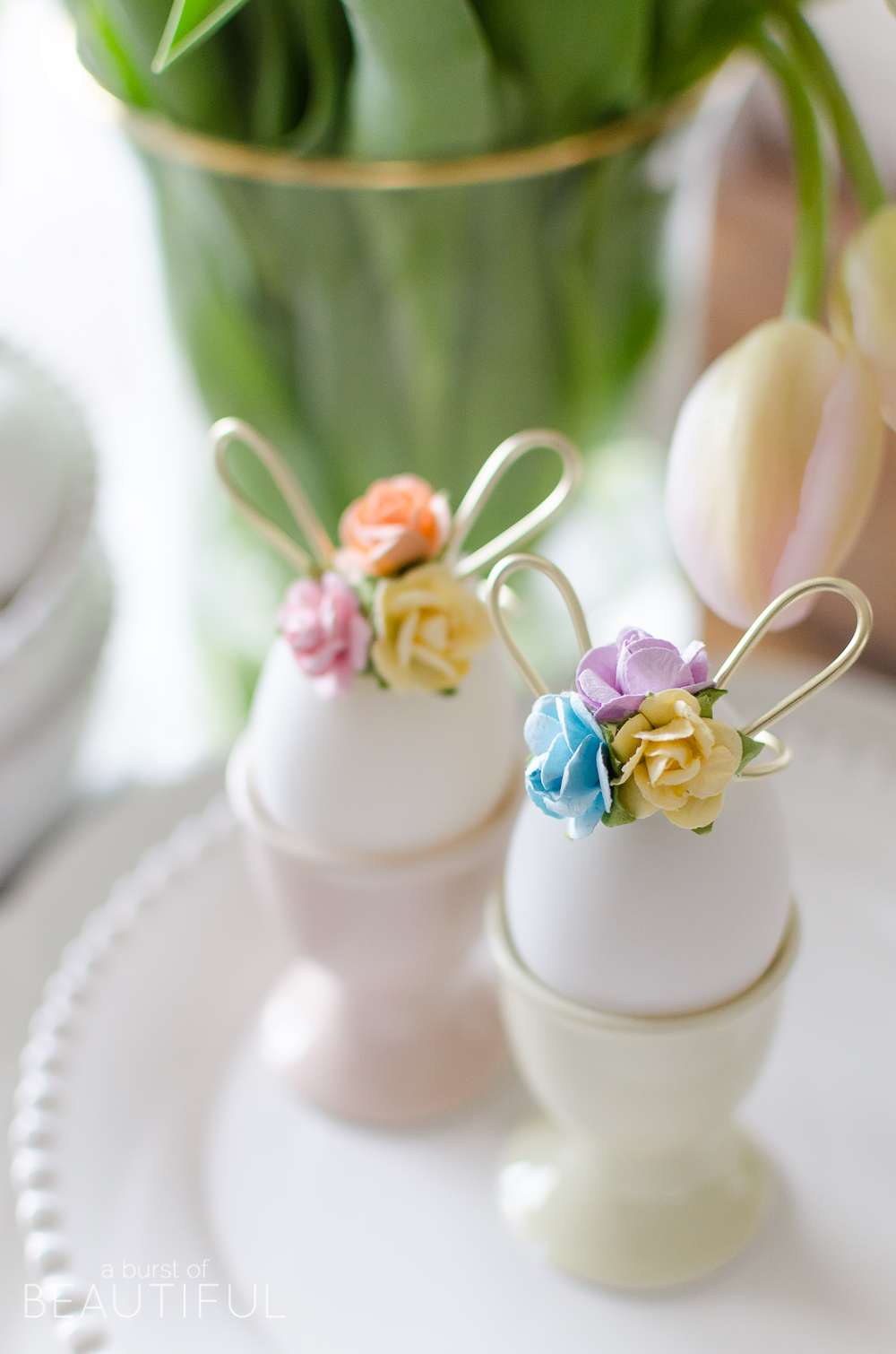 Easter Egg Decorating Idea | Decorate your Easter eggs this holiday with these miniature DIY gold wire bunny ears and floral crowns for a sweet and whimsical touch. 