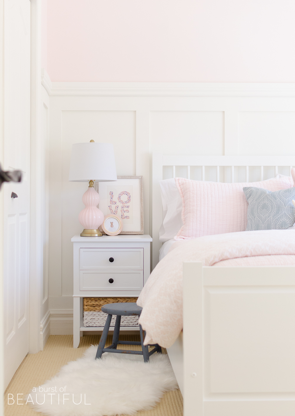 Toddler Girl Pink Bedroom Design & Decor sidetable with art and pink lamp