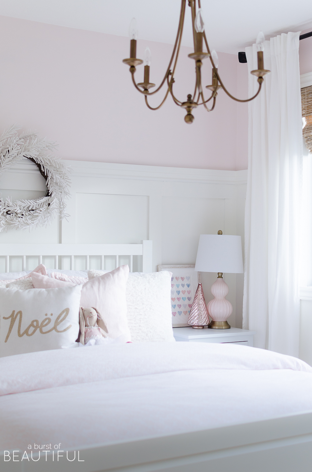 A pink and white Christmas Bedroom