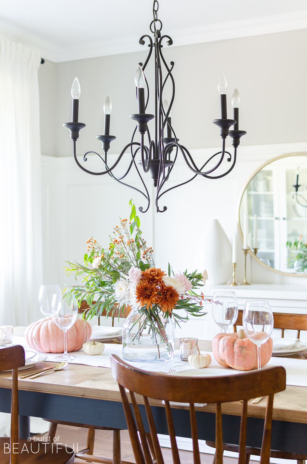 Find inspiration for entertaining this fall season with 16 festive fall tablescapes, including a simple fall table setting in traditional autumn colors. 