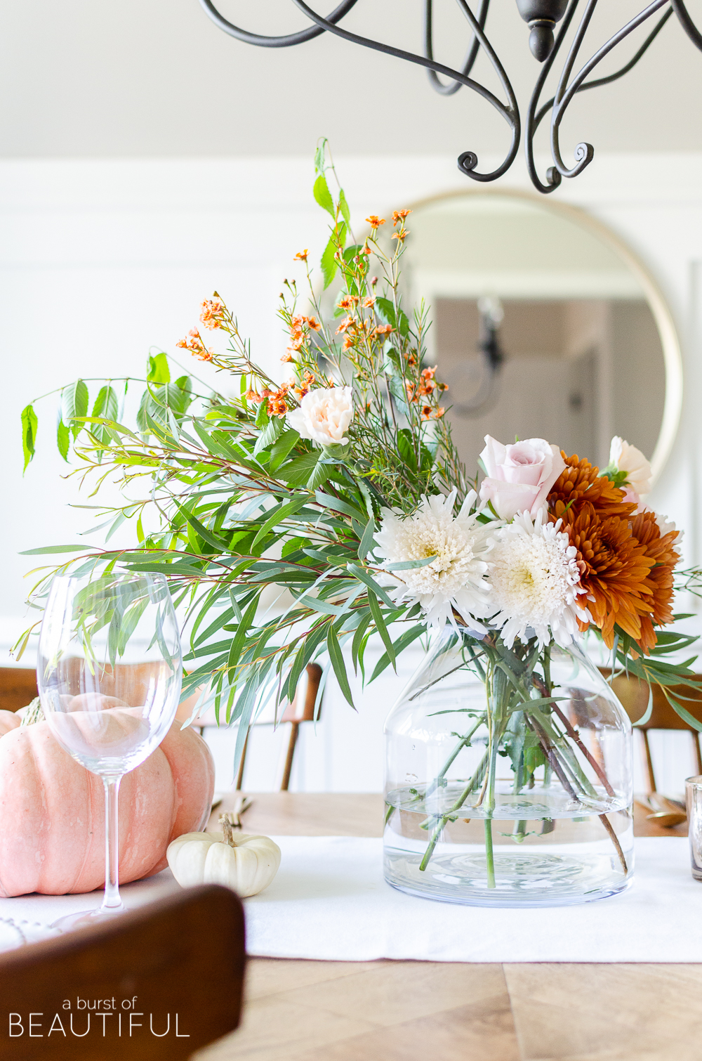 Find inspiration for entertaining this fall season with 16 festive fall tablescapes, including a simple fall table setting in traditional autumn colors. 