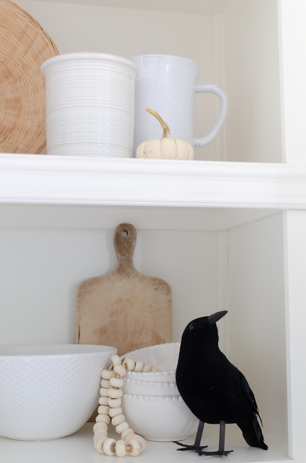 Mini white pumpkins and black crows are a simple way to add a touch of Halloween to your home. Get inspired and celebrate Halloween with 25+ easy decorating ideas. 