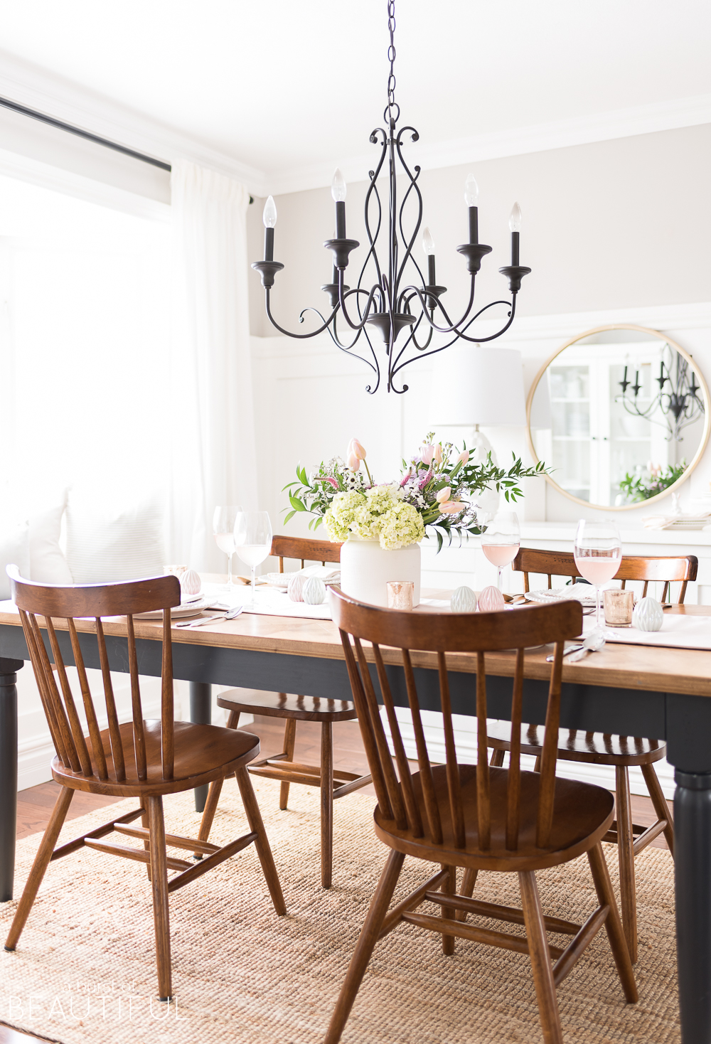 Celebrate Easter around a table set with classic white dishes, linens in pastel shades and a centerpiece full of spring blooms.&nbsp;