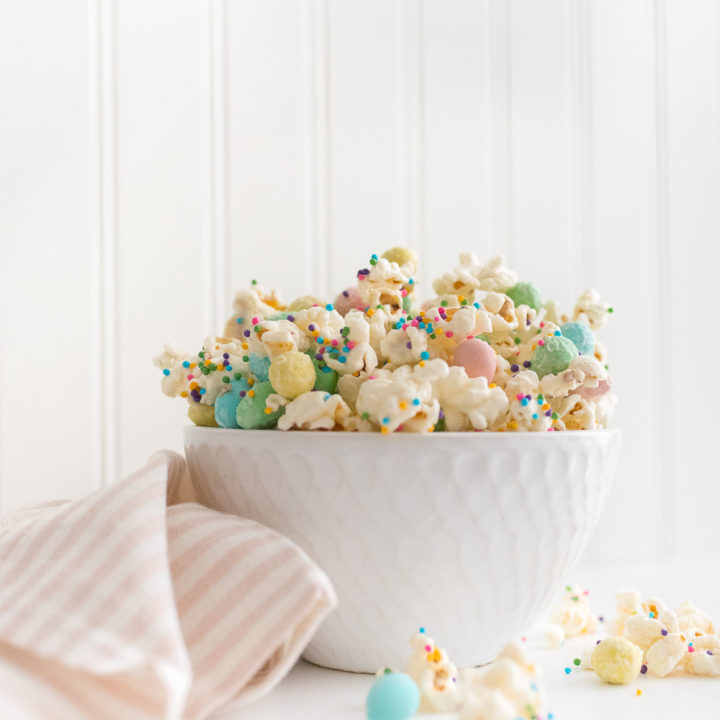 Popcorn drizzled in melted white chocolate and mixed with mini eggs and sprinkles is a fun and sweet treat for Easter, find the easy recipe here.