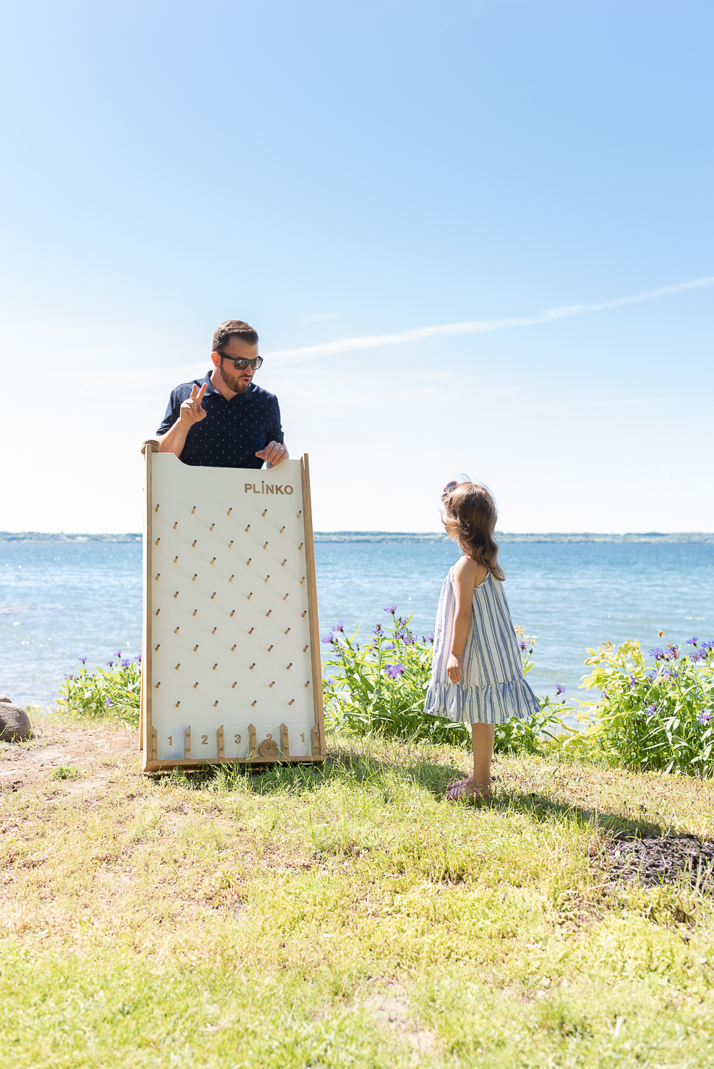Who doesn't love Plinko? This game is the perfect addition to backyard parties (kid or adult parties), school carnivals, or as part of a kids playroom. It will provide lots of fun with family and friends. It's a classic game that crosses all generations, and we have the free DIY plans for you.