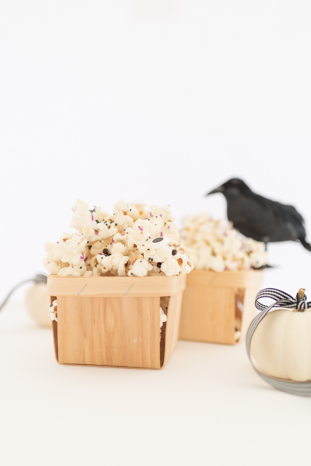 Halloween Monster popcorn drizzled in melted white chocolate and mixed with sprinkles and candy eyeballs
