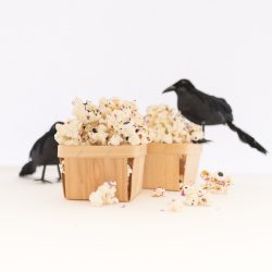 Halloween Monster popcorn drizzled in melted white chocolate and mixed with sprinkles and candy eyeballs