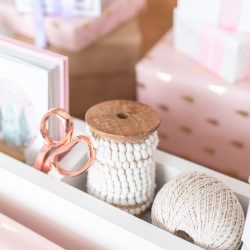 Build your own wrapping paper storage with two dowels to keep wrapping paper easily accessible and four cubbies to store all of your essentials, like Christmas cards, ribbon, scissors, and gift tags.